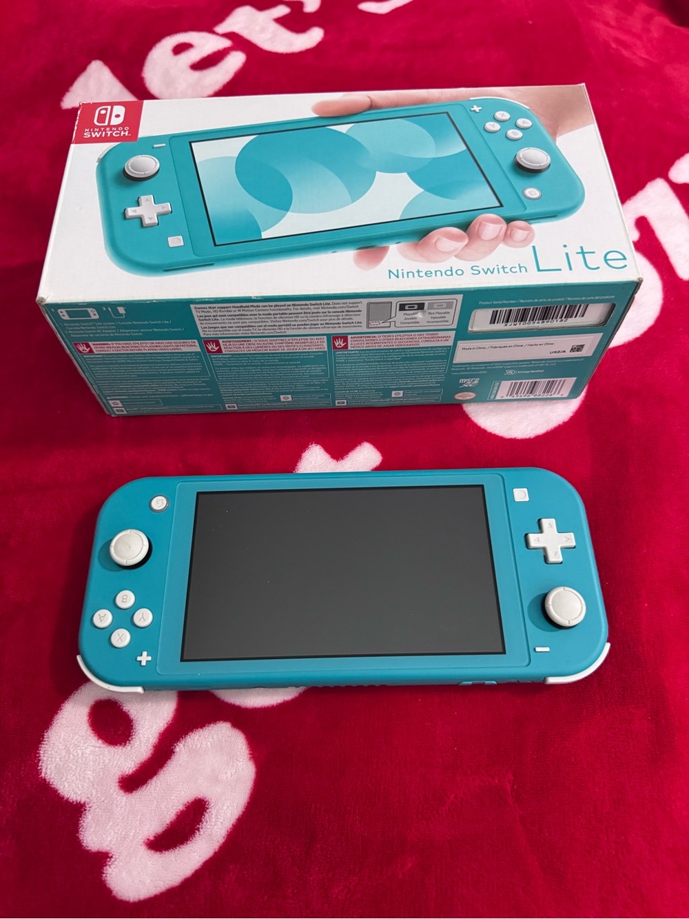 Nintendo Switch Lite Teal Handheld Console with White Buttons